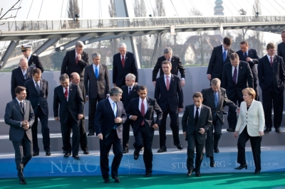 President Barack Obama, NATO Secretary General Jaap de Hoop Scheffer and fellow NATO leaders step down from a photo platform April 4, 2009, following their group photo at the NATO meeting in Strasbourg, France.  Official White House Photo by Pete Souza